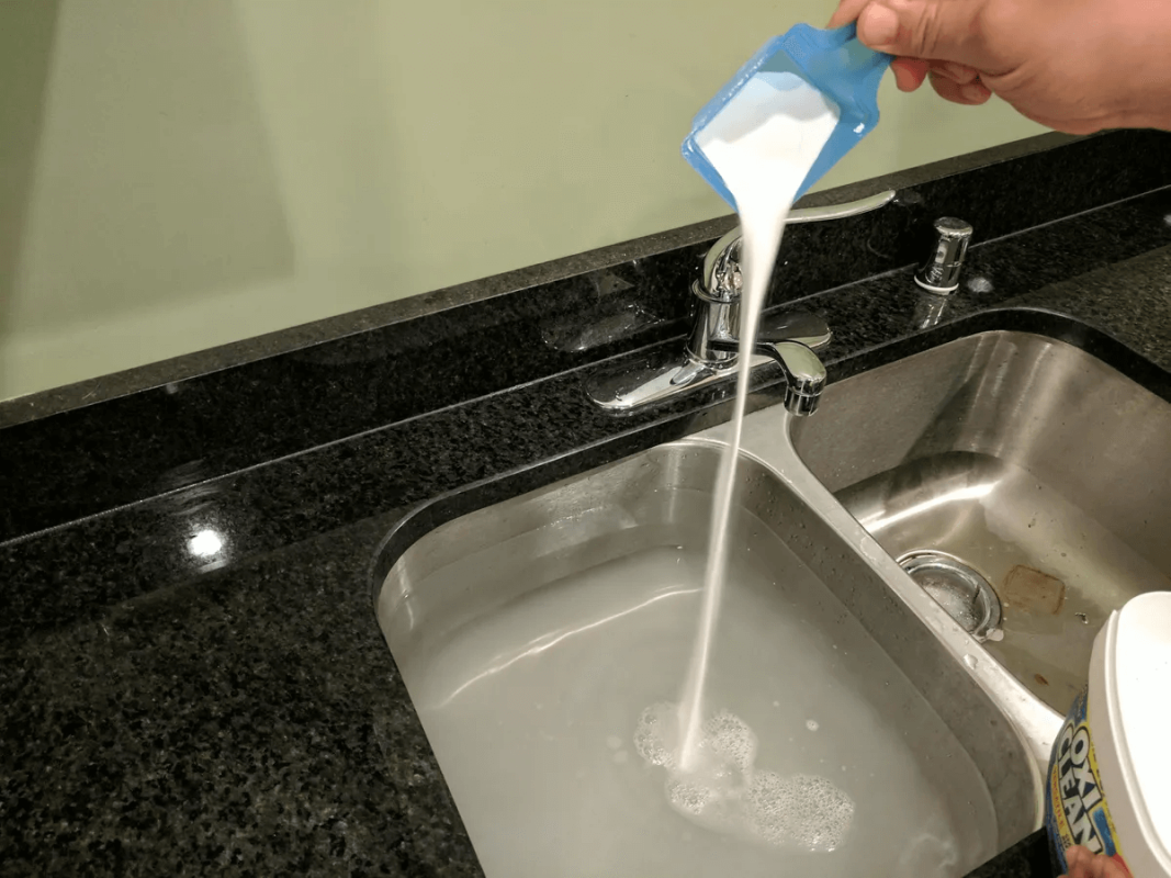 Add baking soda and vinegar to unclog your drain